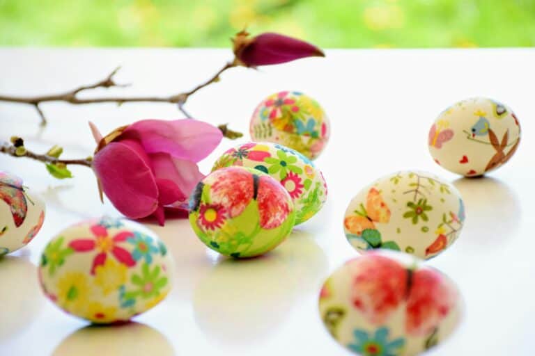 Bright Easter eggs with floral and animal illustrations, pink flower, and spring vibe.