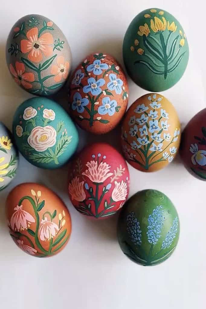 Vibrant hand-painted decorated Easter eggs with floral patterns.
