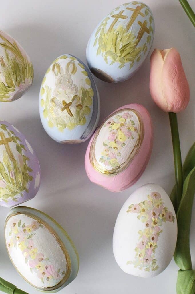 Colorful decorated Easter eggs with floral and religious designs.