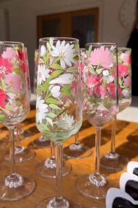 Beautiful hand-painted floral decorated wine glasses for special occasions.